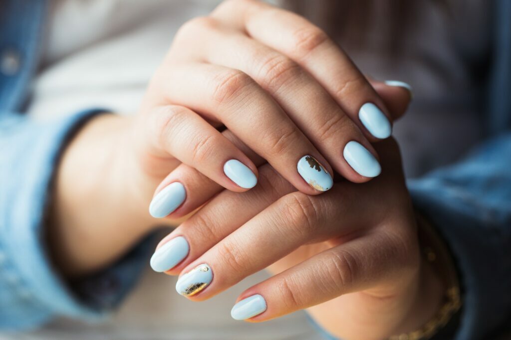 Unique Nail Concepts at XO Nail Salon Sunny Isles. Gel polish coating in blue, embossing.