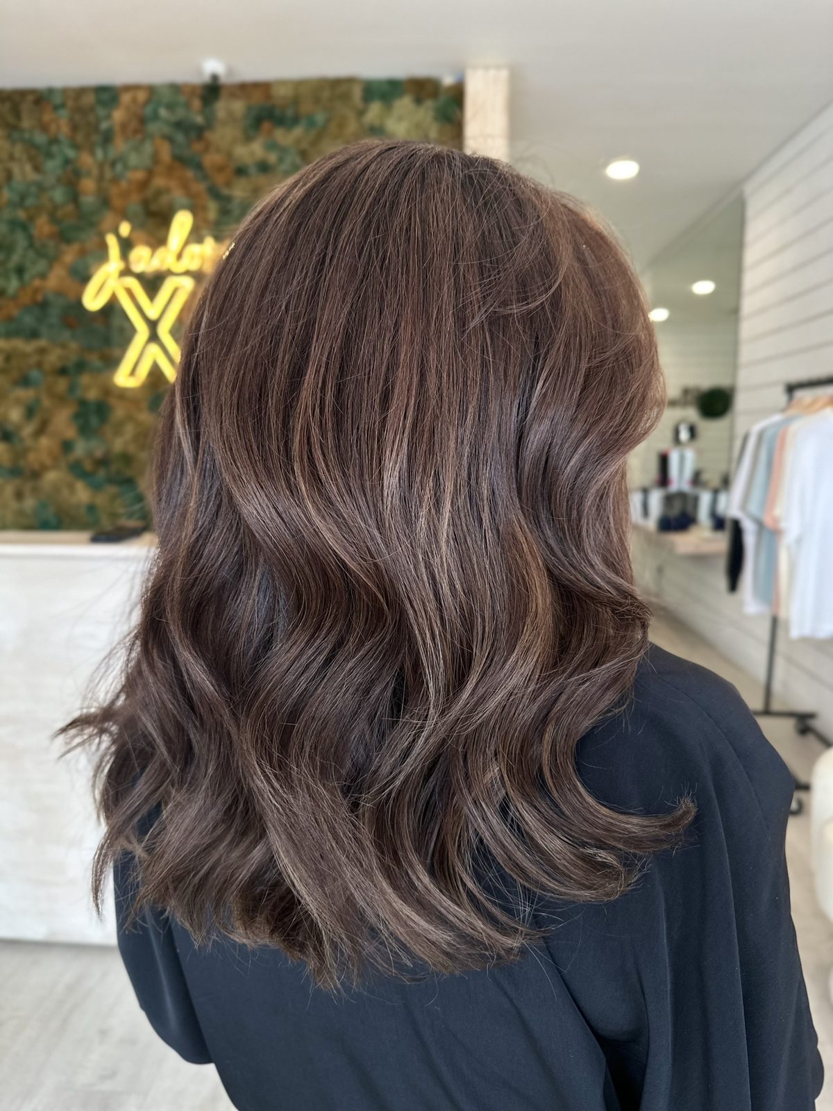 Chocolate brunette balayage with soft caramel ribbons at XO Salon & Spa