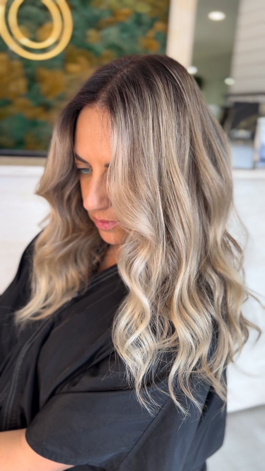 Bouncy blowout waves on blonde balayage hair at XO Salon & Spa in Sunny Isles Beach